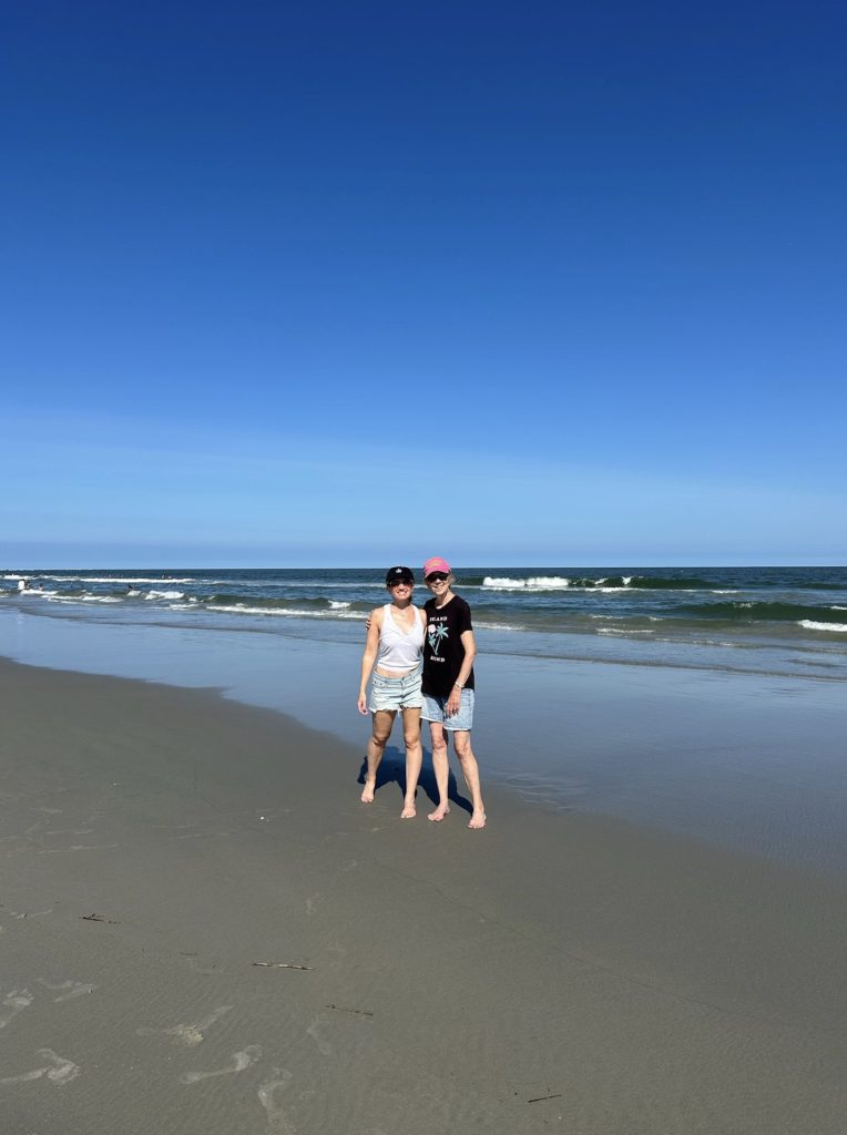 Two women in front of the ocean at the Jersey Shore